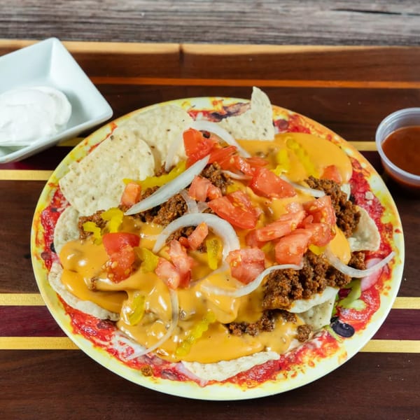 Punxsy Pizza's nachos with ground beef, cheese sauce, tomatoes, onions, and peppers.